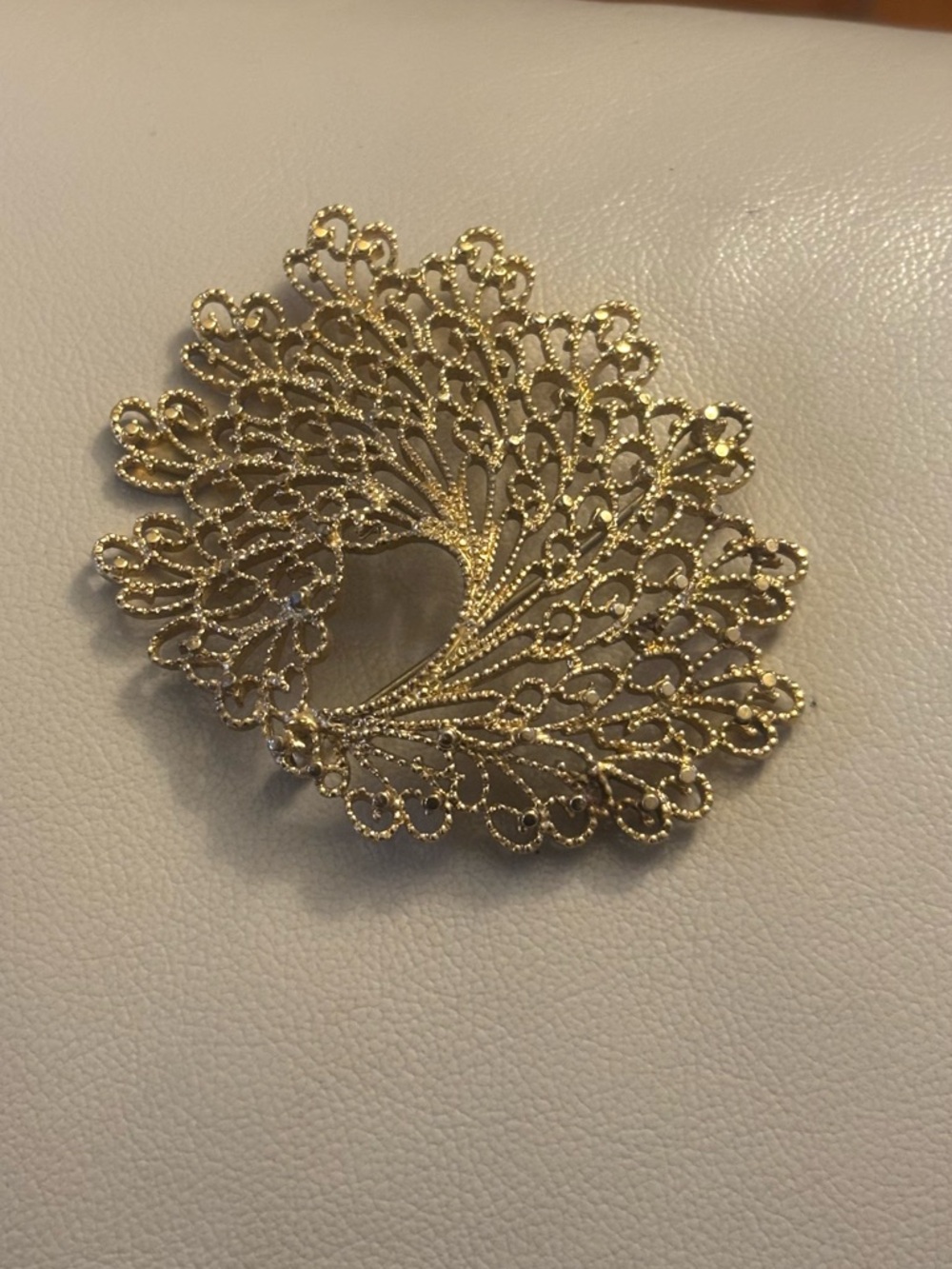 Monet Goldtone filigree brooch